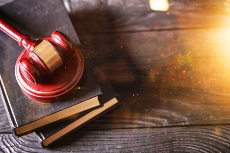 gavel lying on law books